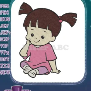 Close-up of an adorable embroidered Boo from Monsters Inc. sitting cross-legged, smiling, with pigtails and a pink dress.