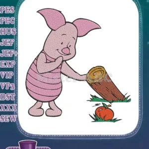 Embroidered Piglet character, looking happy, standing next to a brown log and a small orange pumpkin on green grass.
